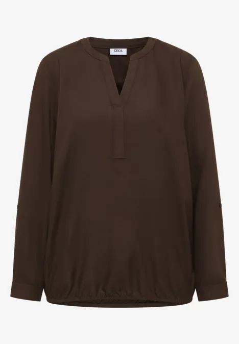 Braune Bluse mit langen Ärmeln und V-Ausschnitt.